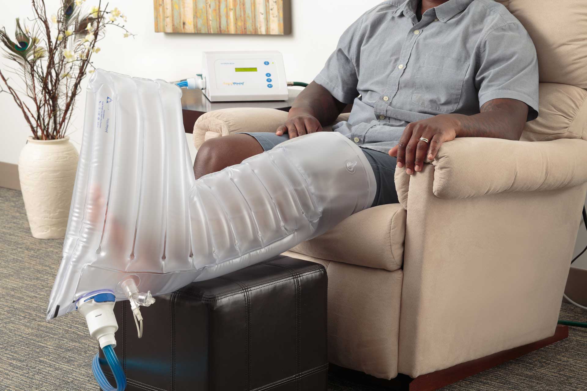 Patient using the LARGE extremity chamber for TWO2 therapy